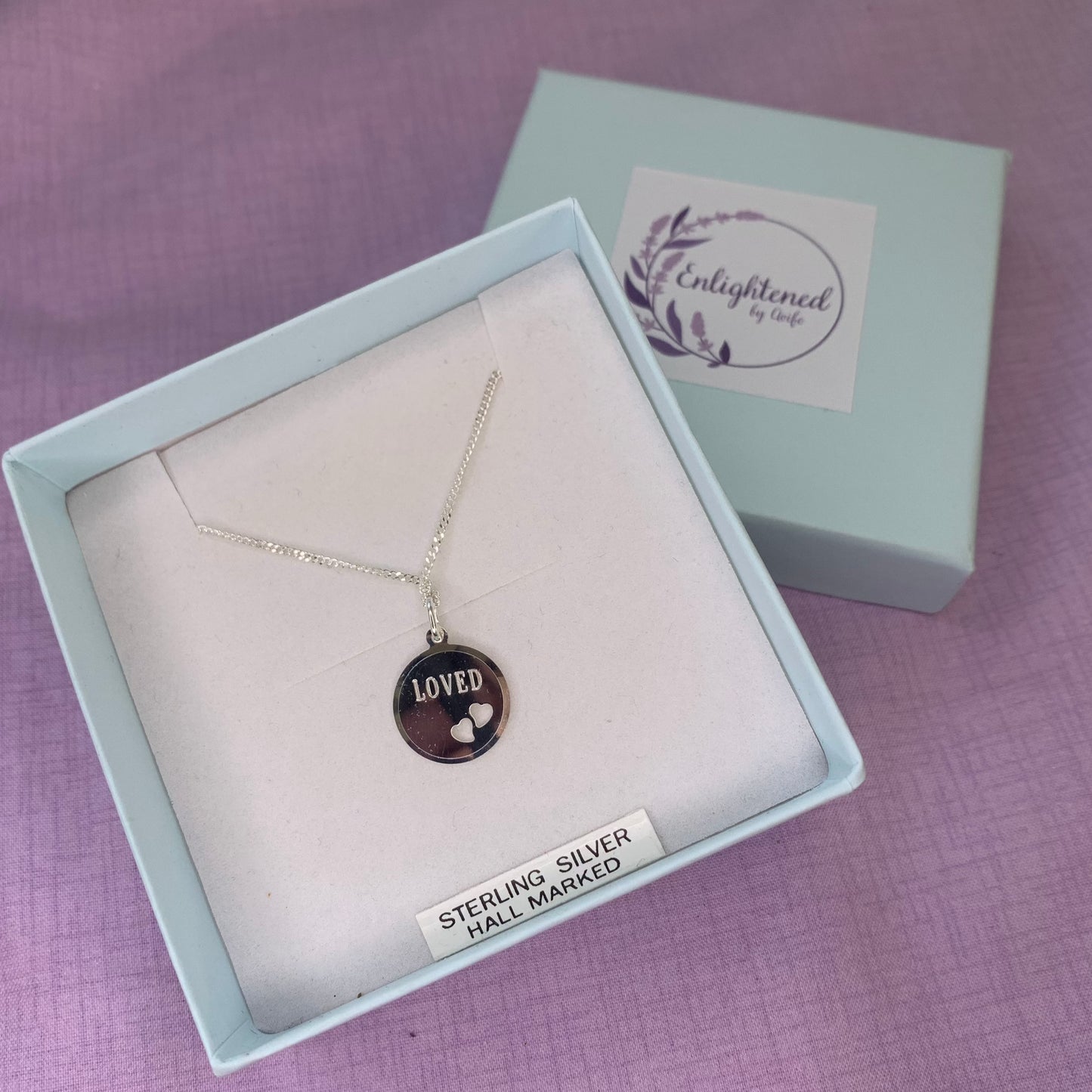 Sterling silver loved affirmation necklace. Disc pendant with heart design is a meaningful gift for ourselves or as a mental health gift to remind those dearest to us that they are loved