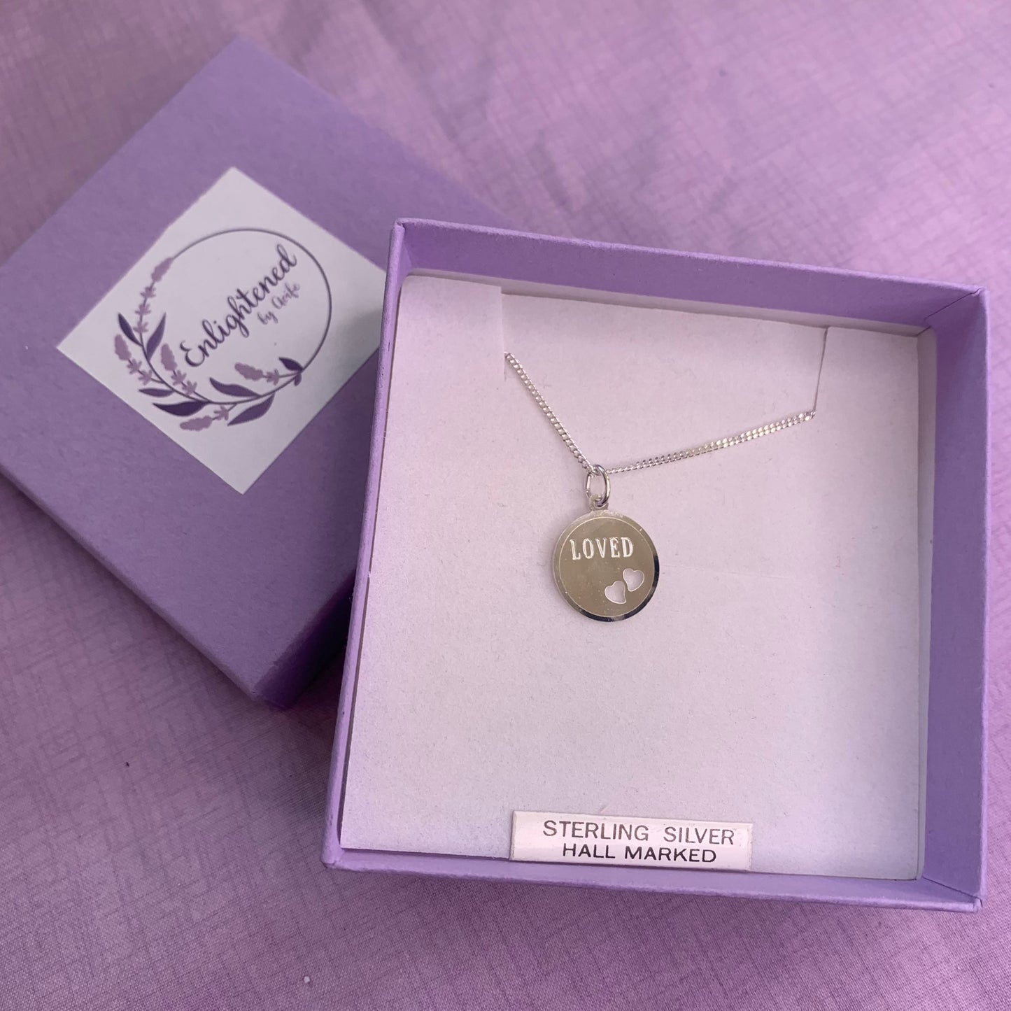 Sterling silver loved affirmation necklace. Disc pendant with heart design is a meaningful gift for ourselves or as a mental health gift to remind those dearest to us that they are loved